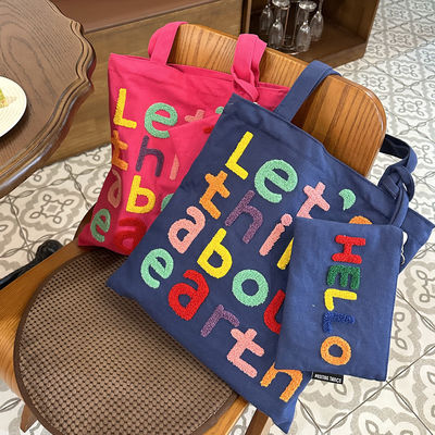Carta bordada colorida Bolsa de ombro de lona Uma escolha funcional e elegante