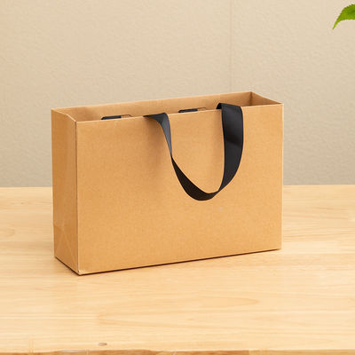 Bolsas de papel impressas personalizadas de papelão Bolsa de presente de papel Kraft branco de luxo para bolsas de compras